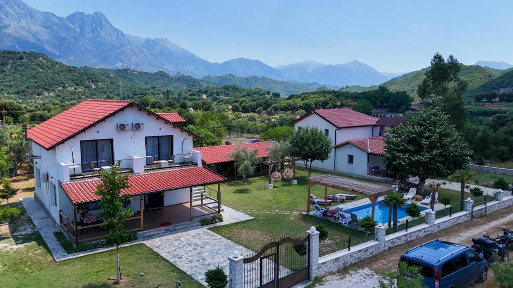 an aerial view of a house and a swimming pool at Guesthouse Micaj LUNI in Himare