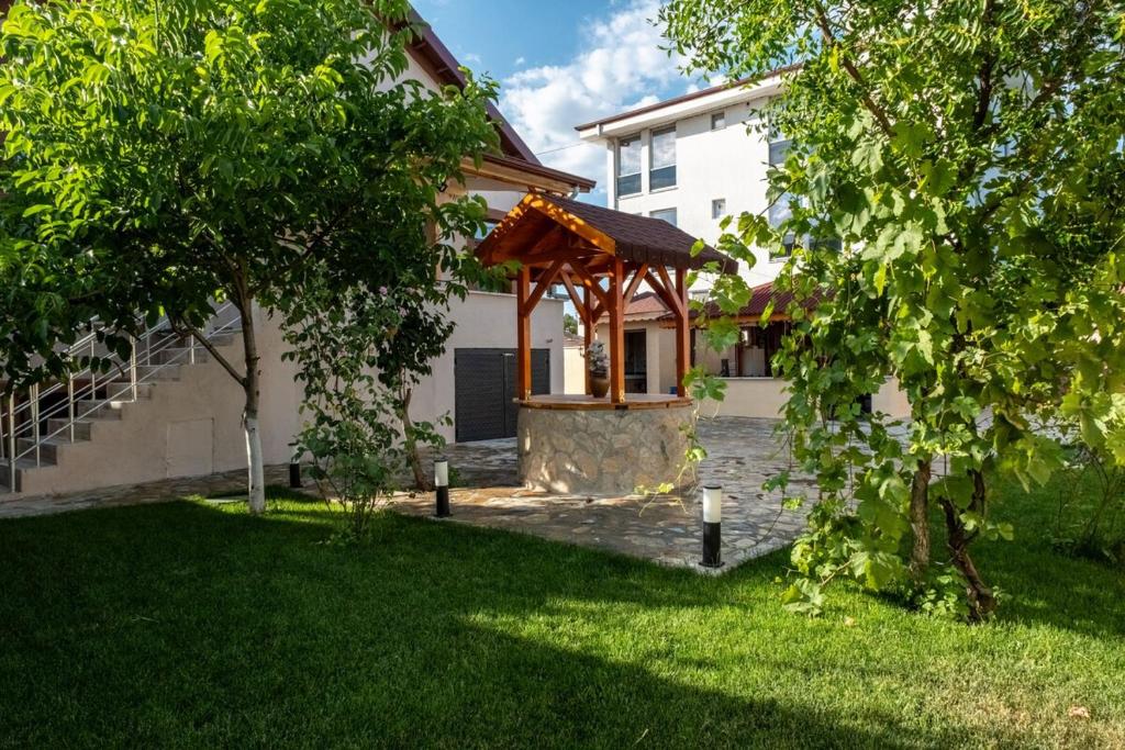 a gazebo in the yard of a house at Golden Tree in Karaağaç