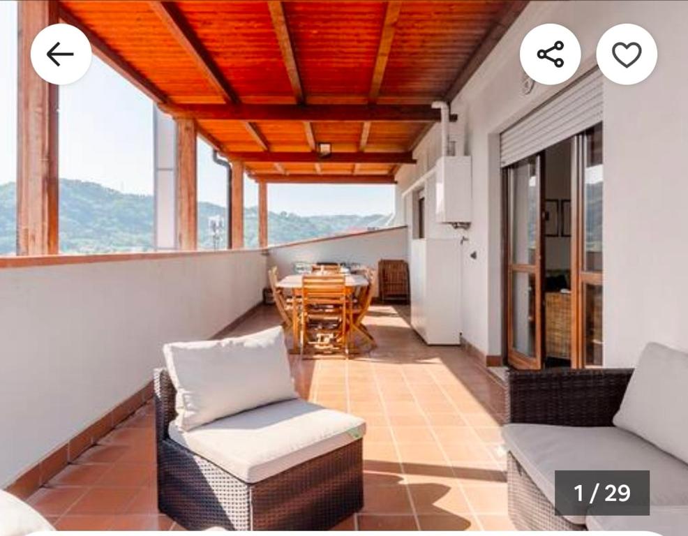 a room with a balcony with a table and chairs at Raggio Di Sole in Cosenza