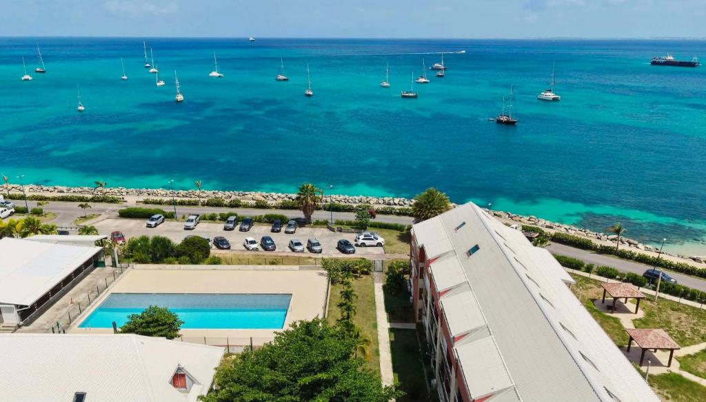 an aerial view of a large body of water with boats at U Are We R St Martin Studio Cosy Marigot, Wi-Fi ,Piscine in Marigot