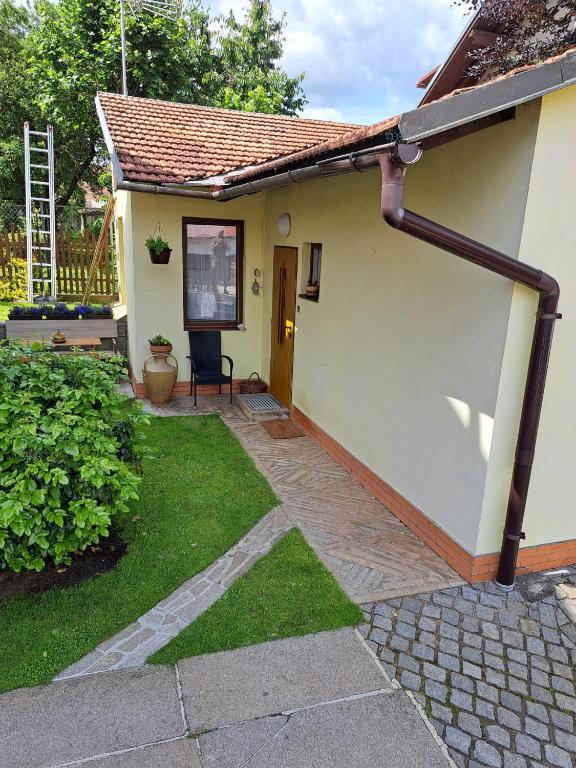 a small house with a patio and grass at Privat Veronika in Telč
