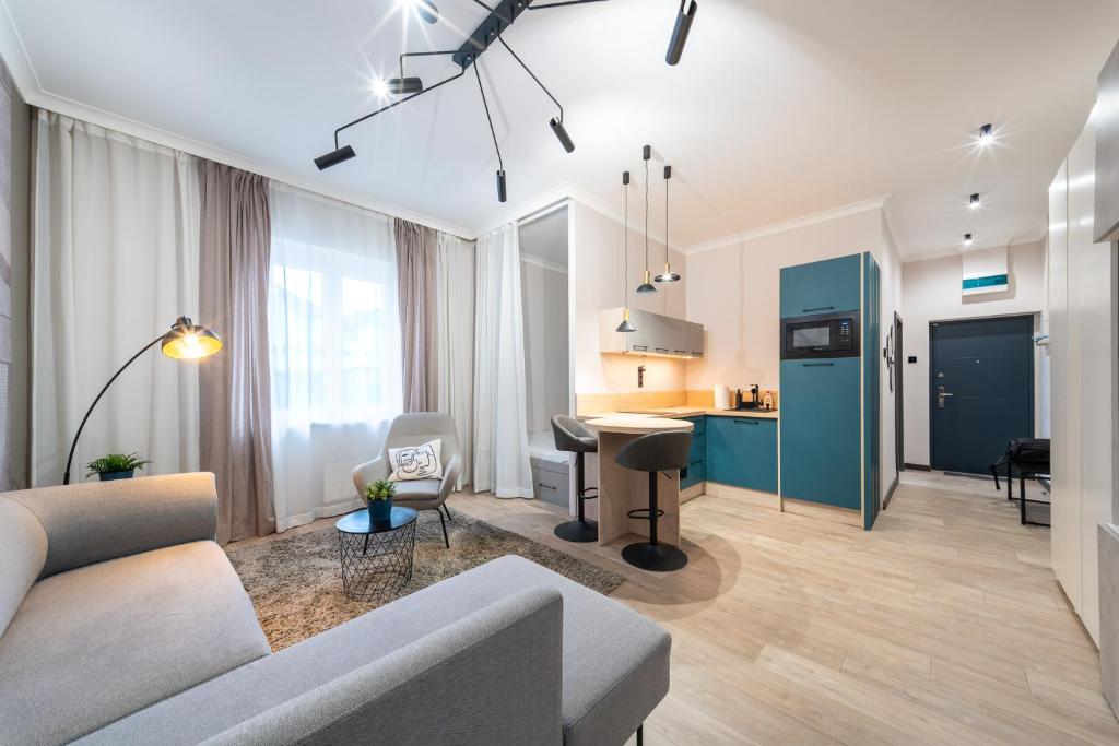 a living room with a couch and a table at Arthur's Home in Miskolc