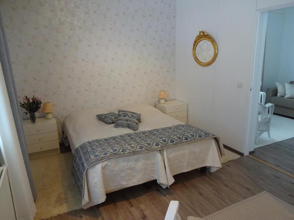 a bedroom with a bed with two pillows on it at Onnela in Saarijärvi