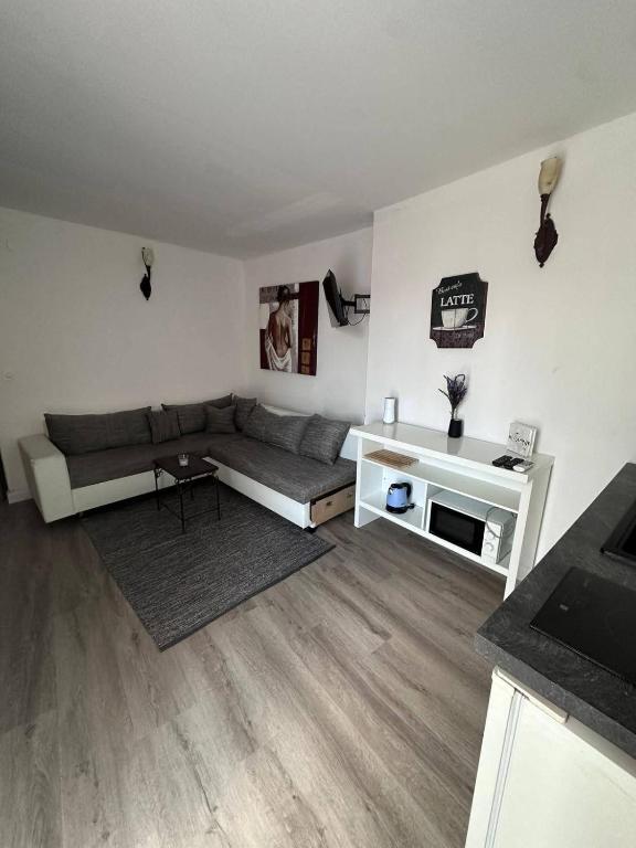 a living room with a couch and a table at Casa del Mare in Vodice