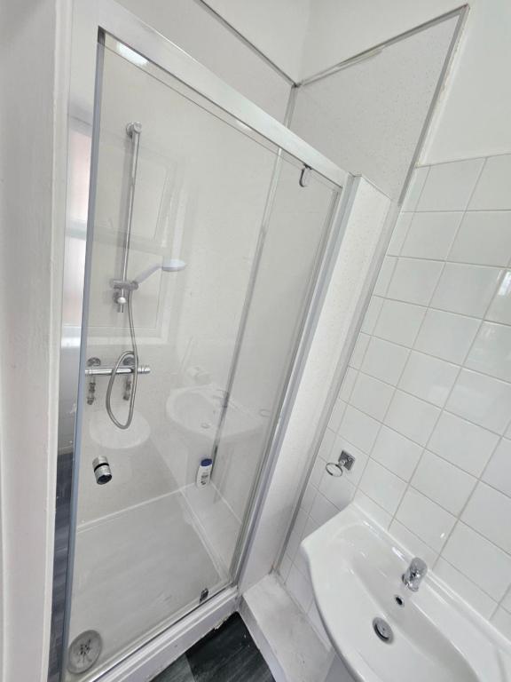 a bathroom with a shower and a sink at Dudley Port in Ocker Hill