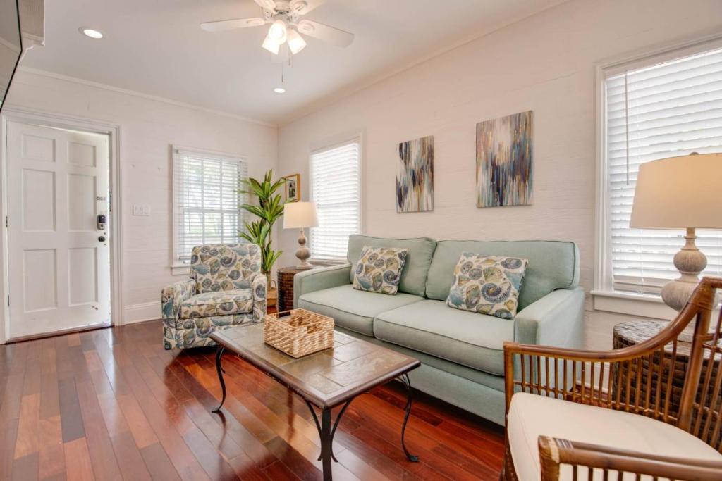 a living room with a couch and a table at Turtle Nest Condo - Pool - 2nd Floor in Key West