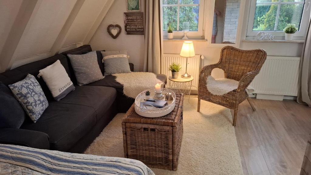 a living room with a couch and a table at Cosy Home in Scharbeutz