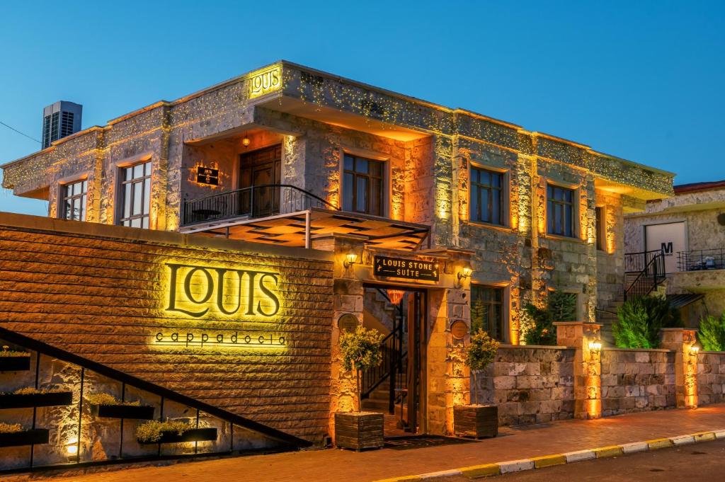 a brick building with a jos sign on it at Louis Cappadocia in Uçhisar
