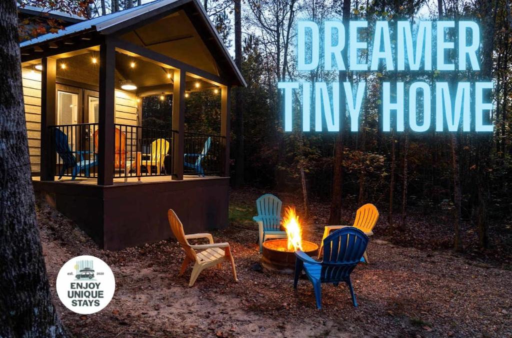 a tiny house with a fire pit in the yard at Dreamer at Mentone with Free Internet in Mentone