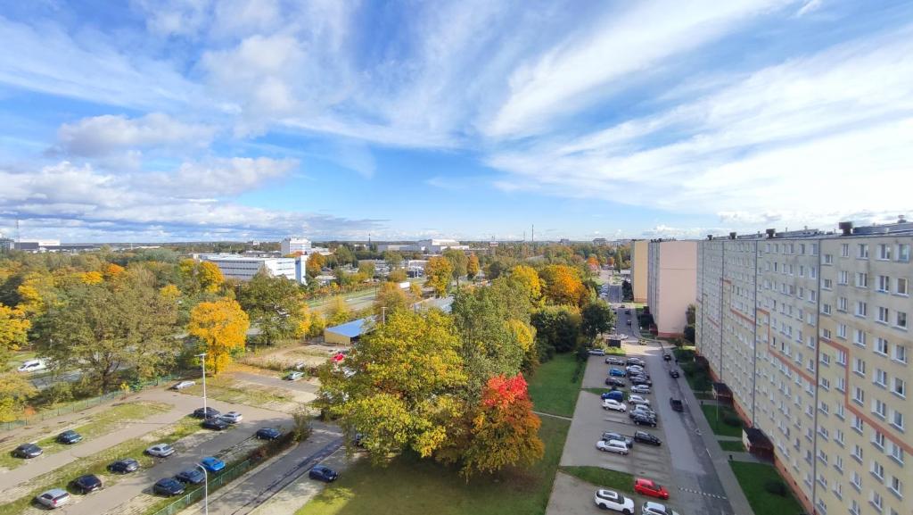 an aerial view of a city with trees and cars at SkyView Studio Łódź - 11th Floor - Free Parking in Łódź