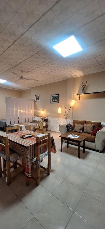 a living room with a couch and a table at Terraza del Rio in Formosa