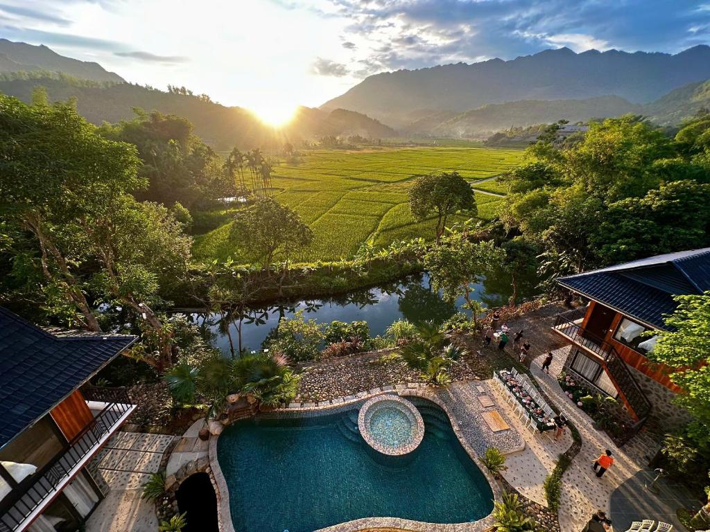 an aerial view of a resort with a swimming pool at Mai Châu Home in Mai Châu