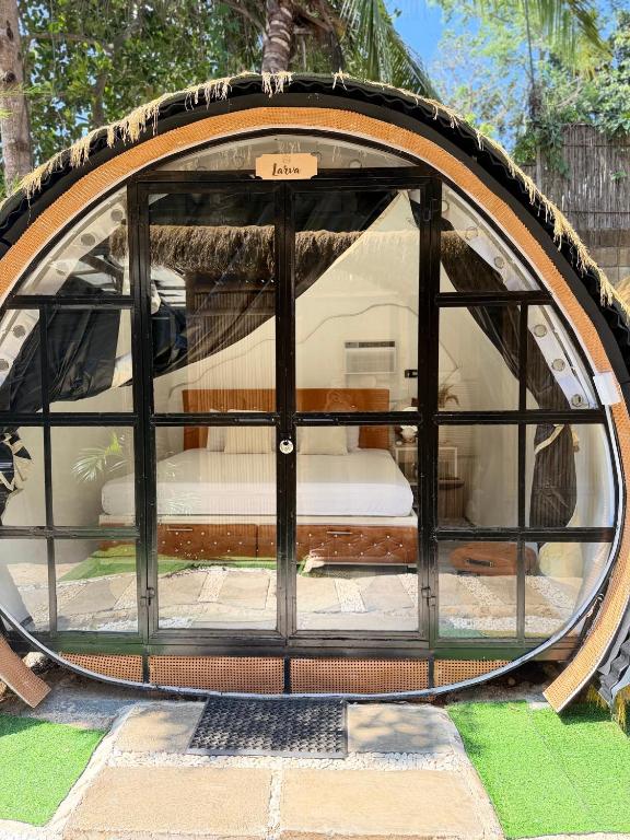 a gazebo with a bed inside of it at Cocoon De Coron in Coron