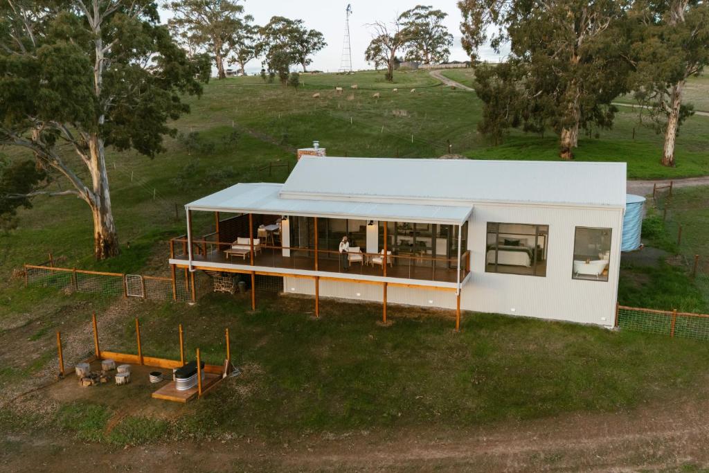 an overhead view of a small white house on a hill at Monapilla Escape in McLaren Vale