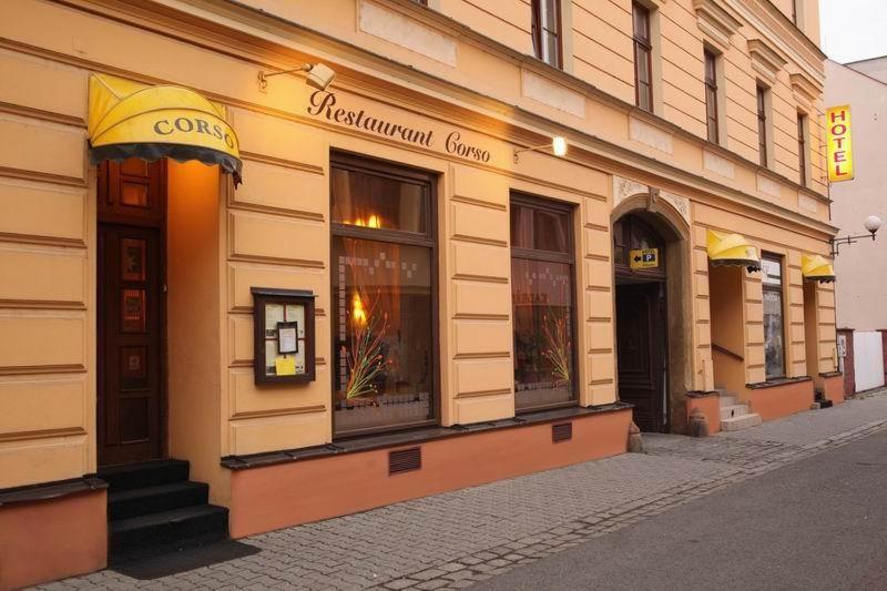 a store front of a building on a street at Hotel Corso T-X in Rokycany