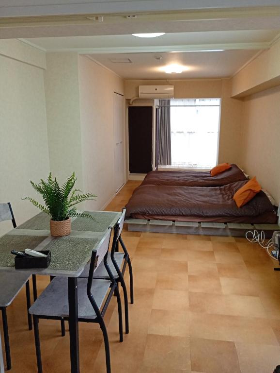 large room with 2double beds next to kuromon market