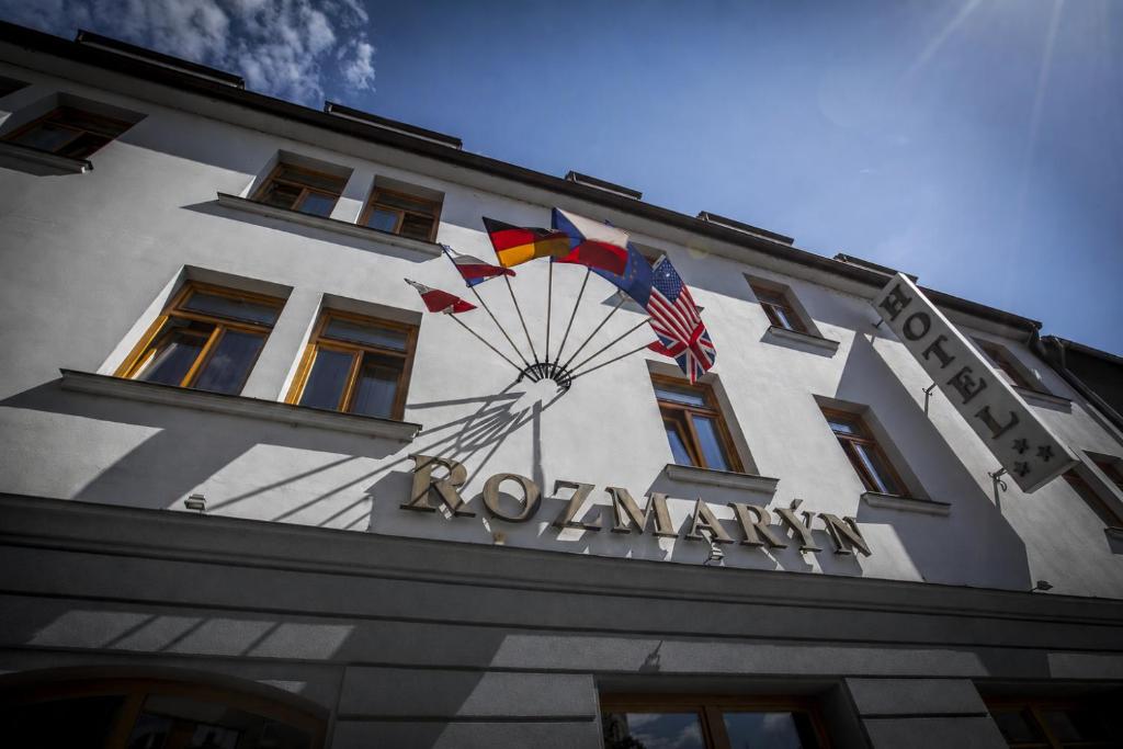 a building with a kite on the side of it at Hotel Rozmaryn B&B in Rakovník