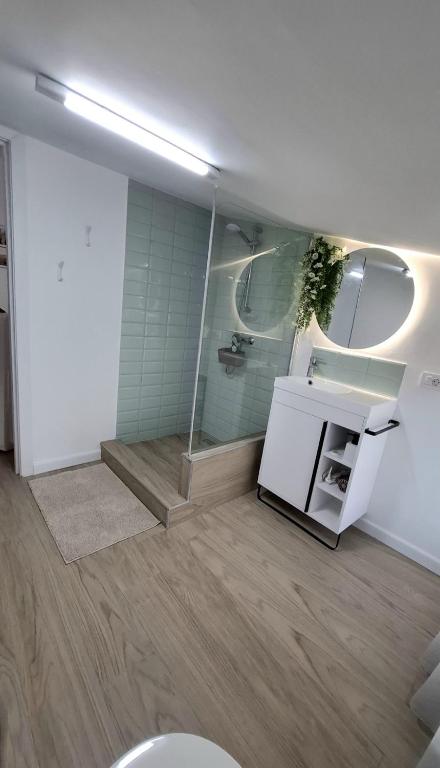a bathroom with a shower and a sink and a toilet at Maracas Sea View Boutiq in Costinesti