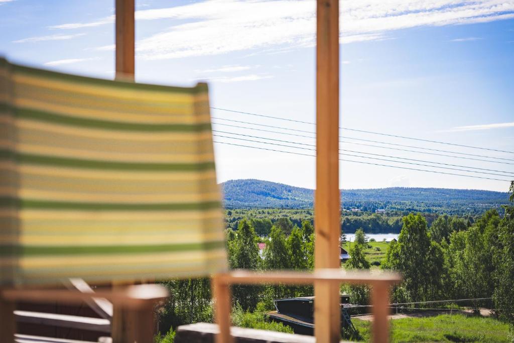 a chair sitting in front of a window with a view at Mukka Mountain in Ruskola