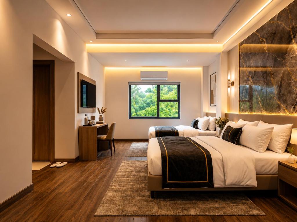 a bedroom with two beds and a desk and a window at Dahabi Airport Hotel Era in New Delhi