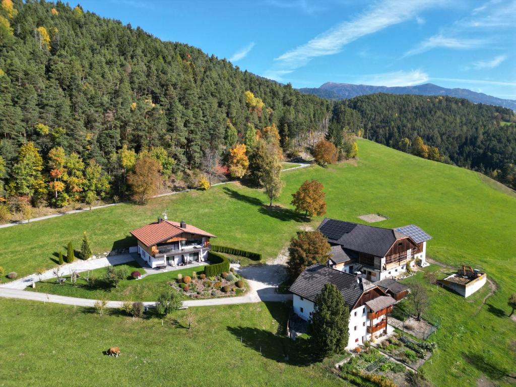 an aerial view of a house on a hill at Appartament Eichnerhof in Chienes