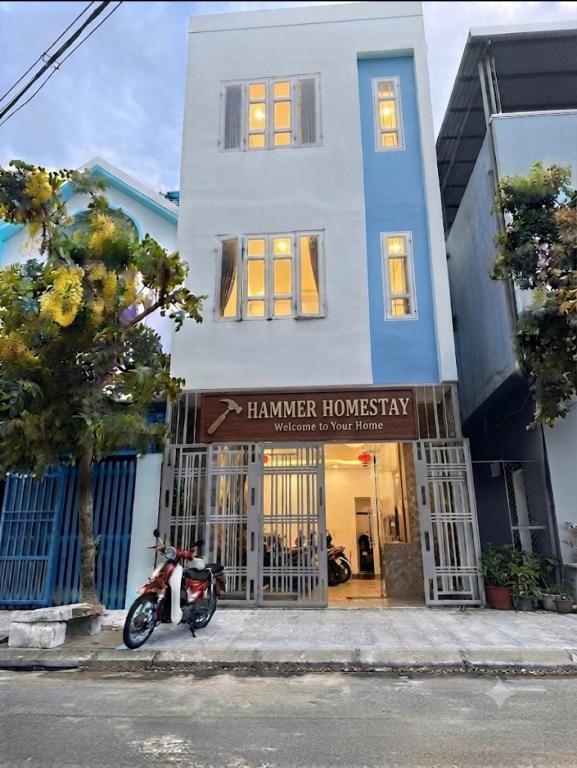 a motorcycle parked in front of a building at Hammer Homestay in Danang