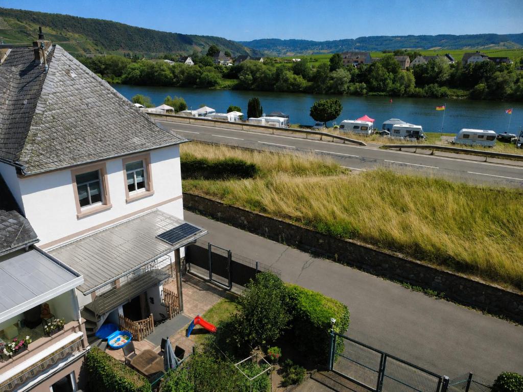 an aerial view of a house and a river at Ferienhaus Anno 1912 in Klüsserath