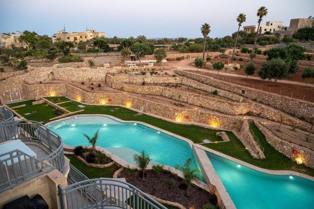 a view of a pool at a resort at Hal Wardija Resort Apartments in Qala