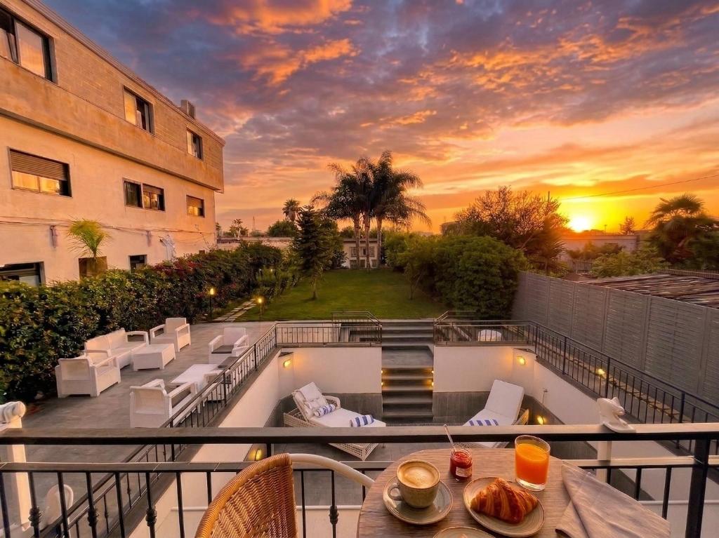 a balcony with a view of a building at Villa Marisa Resort in Castellammare di Stabia