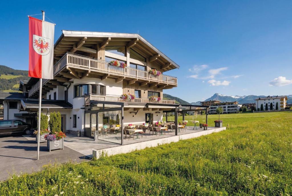 a building with a flag in front of it at Seefeldstub'n in Kirchberg in Tirol