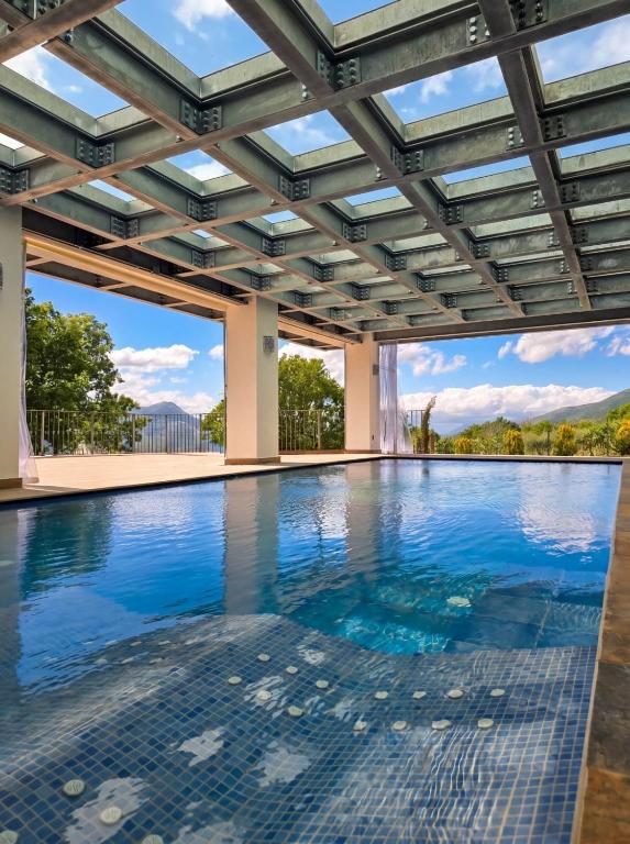 an indoor swimming pool with a glass ceiling at Domus Otium in Atena Lucana