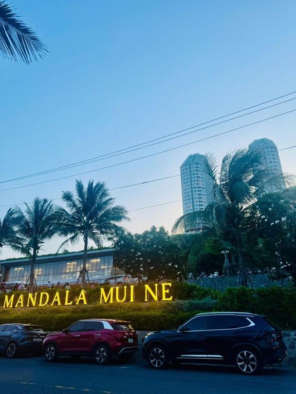 a group of cars parked in front of a building at APEC Mandala in Mui Ne