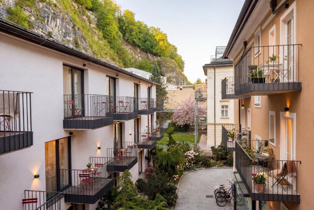 an alley between two buildings with balconies at master Linzergasse in Salzburg