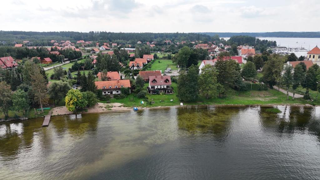an aerial view of a town on a river at Odpocznij -apartament nad jeziorem in Rydzewo