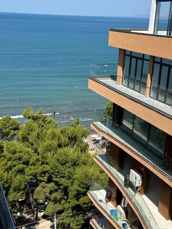 a building with a view of a beach and the ocean at Royal Luxury Apartaments in Lezhë