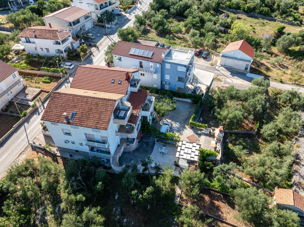 an aerial view of a house with a yard at Villa Bosotina Royal Sea View in Kukljica