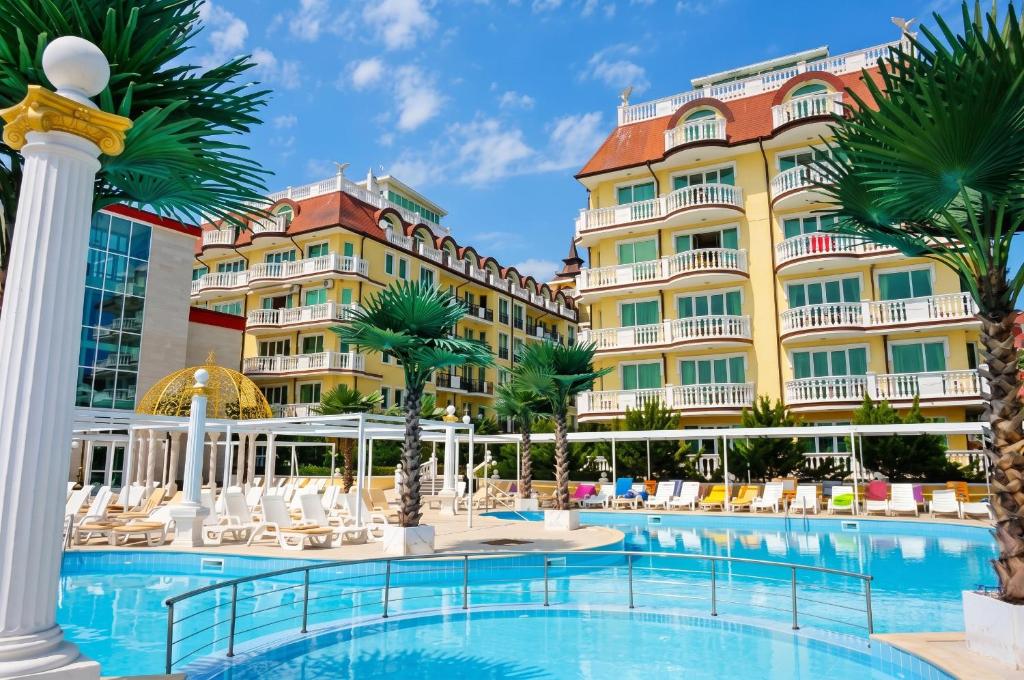 a hotel with a pool in front of a building at Coastal Studio with Sea View in Elenite, 40m² + Pool in Elenite
