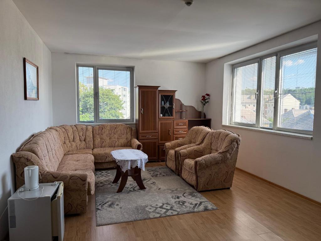 a living room with a couch and two chairs and a table at Penzión Terno in Považská Bystrica