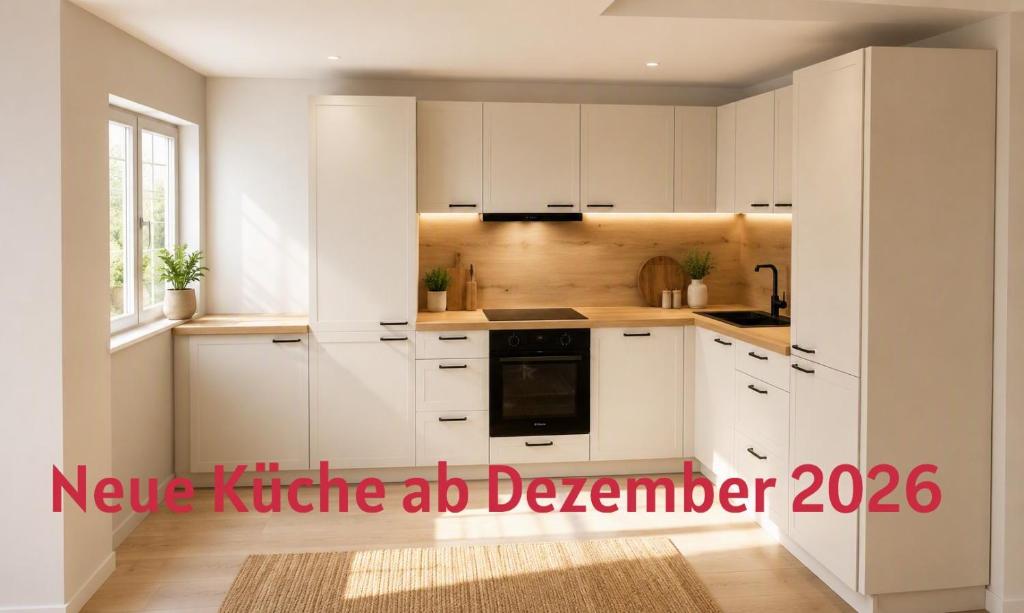 a kitchen with white cabinets and a stove top oven at Ferienhaus Gabriela Allgäu in Immenstadt im Allgäu
