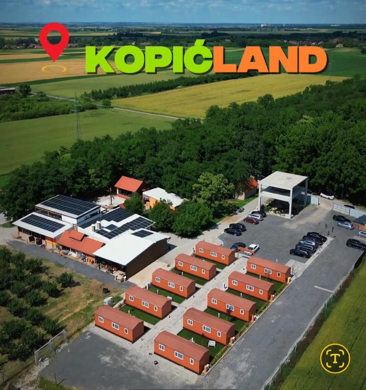 an aerial view of a parking lot with a kpop land at Kopićland HOMES in Marinci