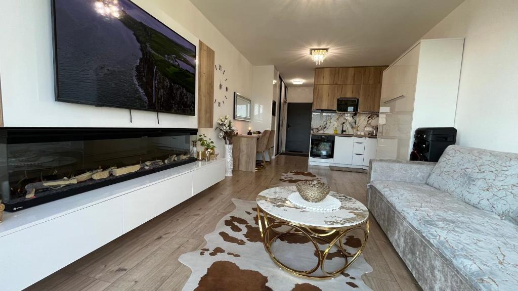 a living room with a couch and a table at Sweet Dream in Dolný Kubín