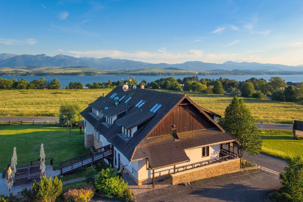 an overhead view of a house with a roof at Serenity Residence Hotel & Wellness in Liptovský Trnovec