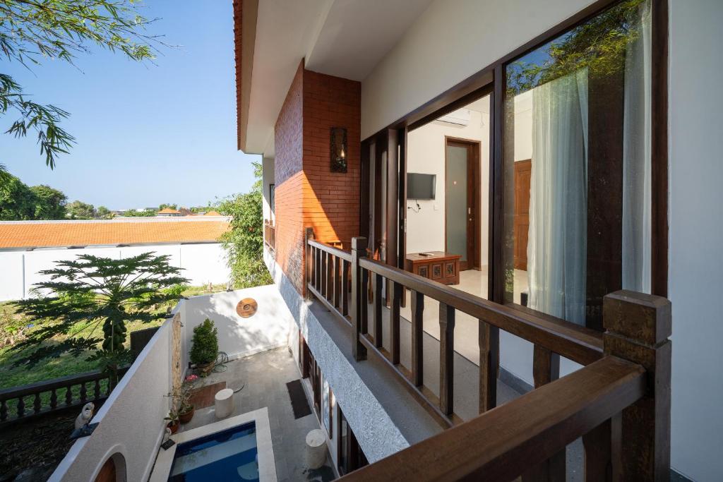 a balcony of a house with a view at Uluran Villa Uluwatu in Uluwatu