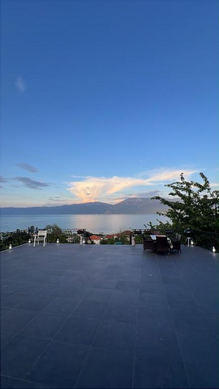 a large patio with a view of the ocean at Vila 4 Stinet in Pogradec