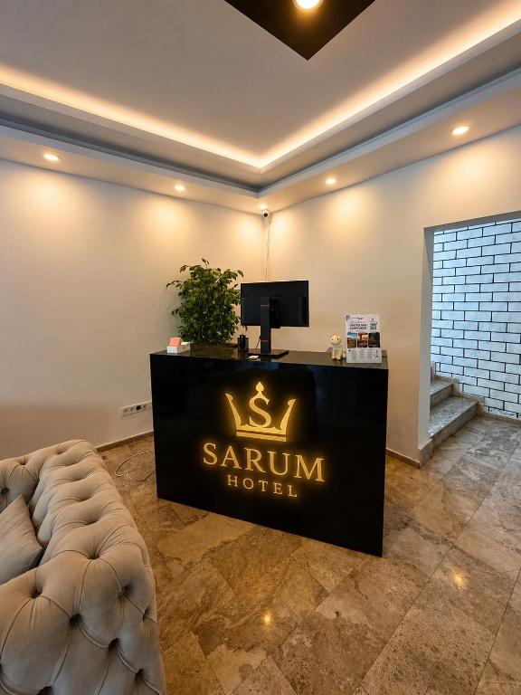 a hotel room with a reception desk in a room at Sarum Çeşme in Çeşme