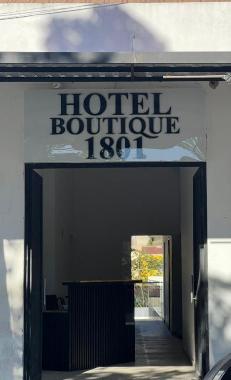 a sign for a hotel boutique with aauthorized entrance at Hotel Boutique 1801 in San Juan de Rioseco 