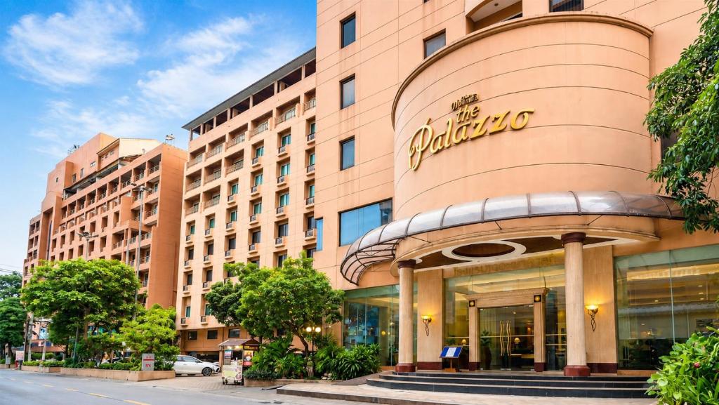 a building with a sign on the front of it at The Palazzo Hotel in Bangkok