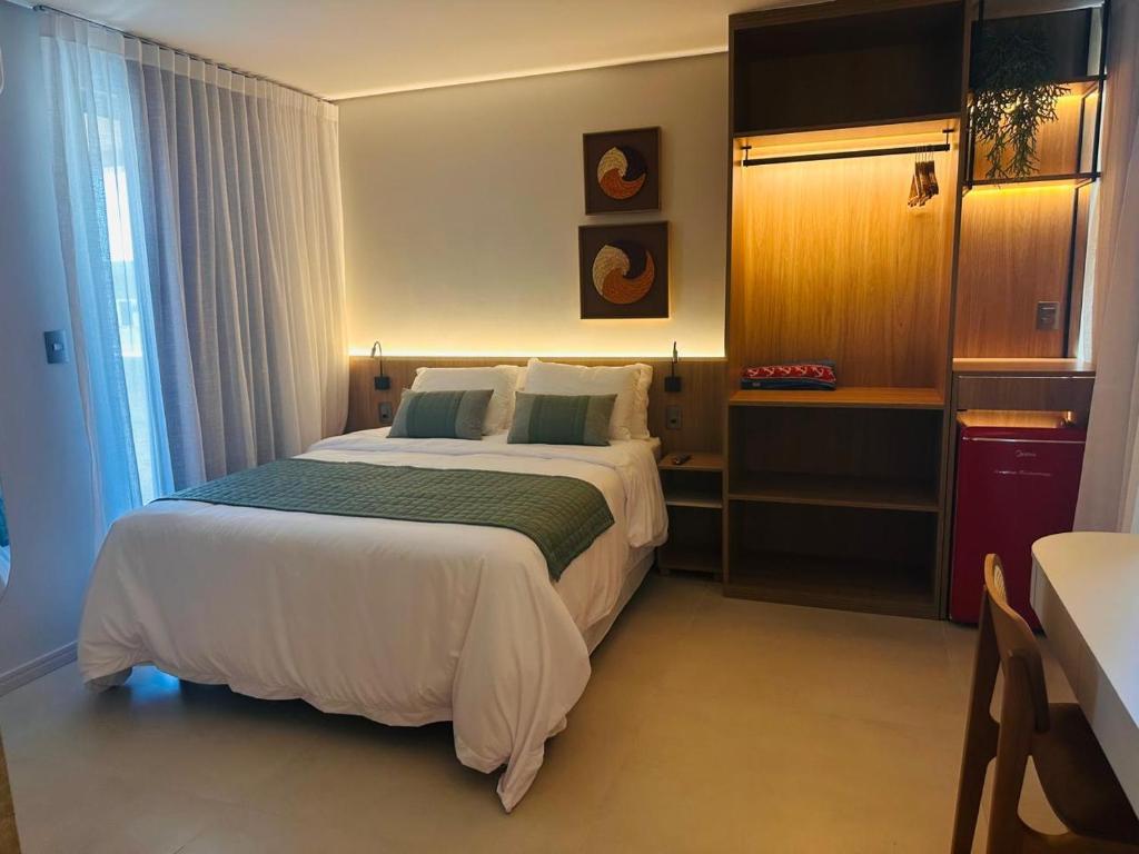 a bedroom with a large bed in a hotel room at Wish Residence Ap 710 in Maceió