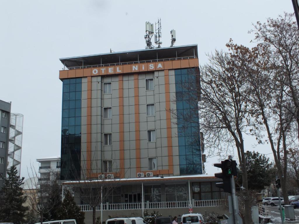 a building with a sign on top of it at Otel Nisa in Nevşehir