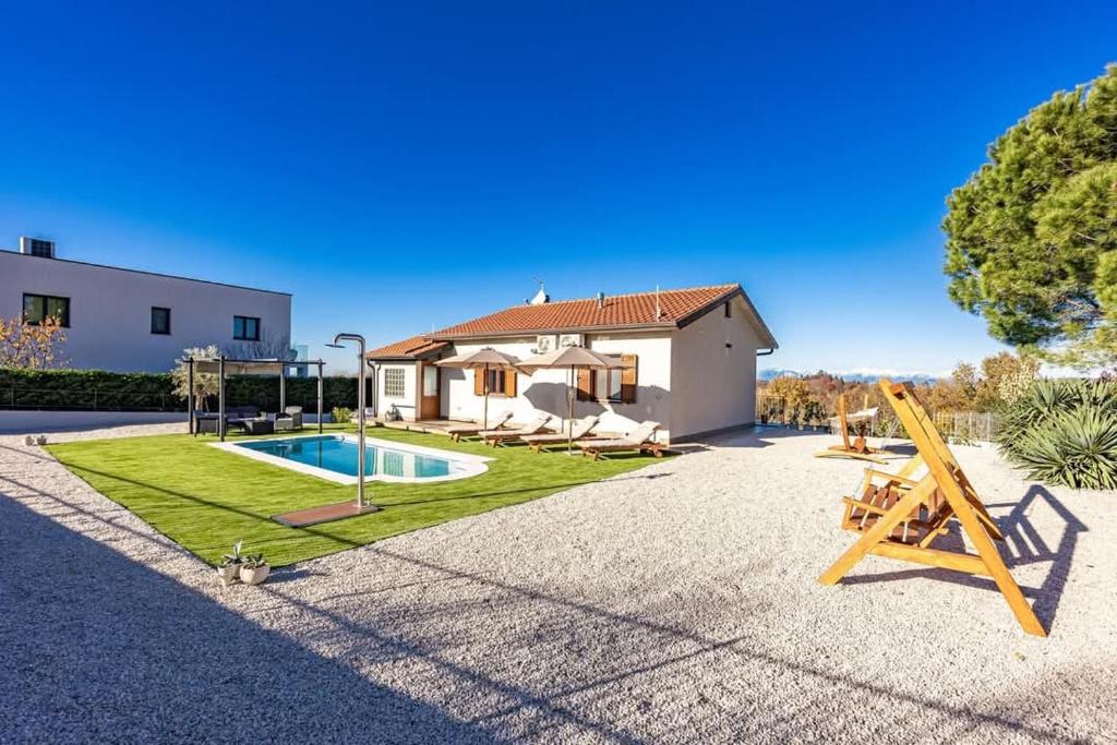 a house with a pool and a playground at Casa Fortunata in Kaštel